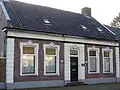 Dorpswoning met bedrijfsruimte