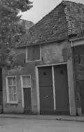 Huis onder schilddak met gepleisterde voorgevel en zijgevel (inmiddels gesloopt)