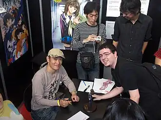 Masakuza met een fan.