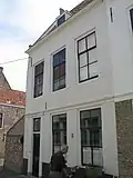 Huis met gecementeerde lijstgevel