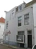 Apart genummerde zijingang in achterbouw van het pand Molstraat 23