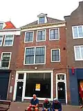Huis/Winkel met eenvoudige kroonlijst F. Sandijck jr. in wederopbouw stijl