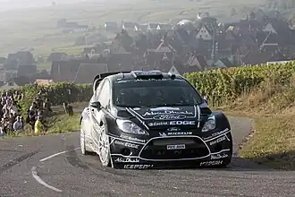 Hirvonen greep na Solberg's diskwalificatie naar het podium en kwam langszij aan Loeb na diens DNF