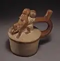 Een bevalling op vaas van Moche-aardewerk
