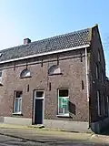 Woonhuis voormalig bedrijfsgebouw
