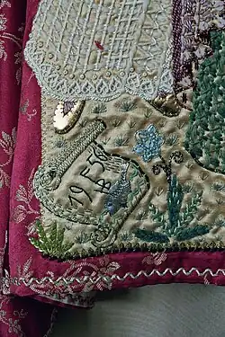 Detail borduurwerk Hildegard Brom-Fischer met monogram en jaar (1956)