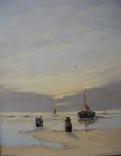 Bomschuit op het strand bij zonsondergang