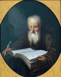 Lezende monnik met een veer in zijn hand