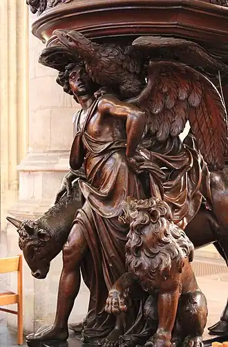 Vier evangelisten schragen de preekstoel in de Zavelkerk