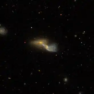 NGC 4837-2 (linksboven)