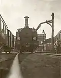 Stoomlocomotief nr. 8130 tijdens waternemen te Wageningen. (28-03-1932)