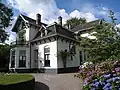 Villa “Reefhorst”, koetshuis en tuin