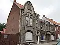 Art-deco-getint woonhuis met aanpalend bedrijfsgebouw