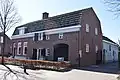 Woonhuis met vm. graanmaalderij / pakhuis,