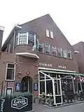Café en appartementen (voorheen:Hotel, zaal en woningen)