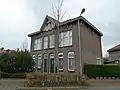 Woninggroep Nuinhof: 2 arbeiderswoningen