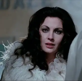 Screenshot Olga Karlatos in Amici miei (1975).