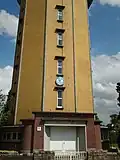 Perceel met watertoren, met bijhorende villa