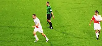 Van Boekel tijdens een wedstrijd in de eredivisie tussen FC Utrecht en Willem II. Links Michael Silberbauer, rechts Simon Cziommer.