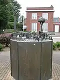 Bronzen sculptuur Wachten op de tram