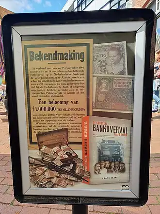 poster over bankroof Almelo 1944, gefotografeerd in 2022