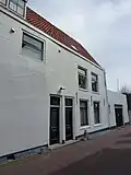 Zijgevel van het diepe hoekhuis St. Janstraat-Domusstraat