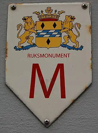 Monumentschildje voor een rijksmonument in de gemeente Woerden