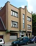 Woon- en winkelhuis van 1938 naar ontwerp van J. Van Peteghem