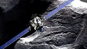 Rosetta rondt de komeet. De lander Philae hangt er onder.