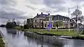 Ruischerbrug met voormalig gemeentehuis Noorddijk