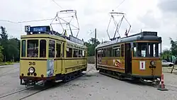 Motorwagen SFV 36 uit Flensburg en motorwagen ÅS 3 uit Aarhus.