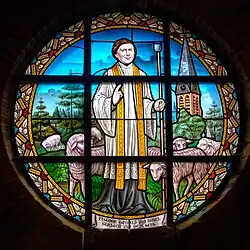 Rondvenster met de stichter, pastoor Gerardus Petrus Tusveld van Boxel