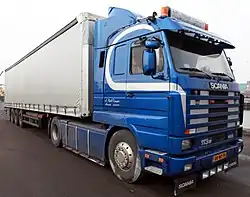 Scania 113M&nbsp;400 trekker met oplegger
