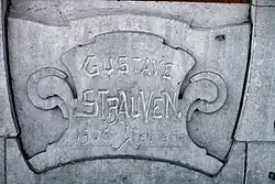 Inscriptie in de gevel van de woning te Schaerbeek, Louis Bertrandlaan 53-61