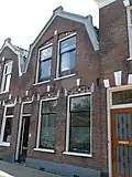 Woonhuis met zilversmidwerkplaats in sobere detaillering in neorenaissancestijl