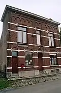 Gemeentehuis van Sint-Laureins-Berchem, gemeenteschool en onderwijzerswoning