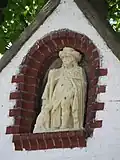 Beeld van Sint-Rochus in de gevelnis
