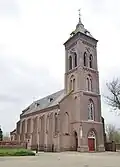 Grote grafzerk en torenportaal van de R.K. Kerk St. Vincentius