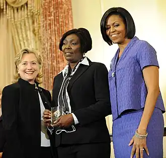 Solange Pierre met Hillary Clinton en Michelle Obama en 2010