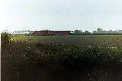 Arriva-Spurt passeert de spoorbrug over het Westeremdermaar