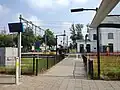 Achteringang van het station
