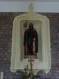 Beeld van Sint-Rochus boven het altaar
