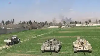 Syrische tanks tijdens het offensief tegen rebellen in het oosten van Ghouta in maart 2018. Een maand later was het hele gebied in handen van het regeringsleger.