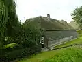 Boerderij, oorspronkelijk hallehuis met middenlangsdeel, later uitgebreid tot krukhuis, opgetrokken in Ambachtelijk-traditionele bouwtrant