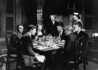 Scène uit The Stranger. V.l.n.r. Richard Long, Edward G. Robinson, Loretta Young, Martha Wentworth, Orson Welles, Philip Merivale, Byron Keith (en nog enkele anderen)