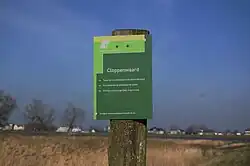Toegangsbord Cloppenwaard, met Boven-Hardinxveld op de achtergrond