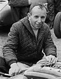 John Surtees, wereldkampioen in 1956, 1958, 1959 en 1960 (en in 1964 in de Formule 1)
