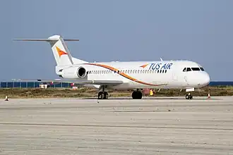 Een Fokker 100 van Tus Airways