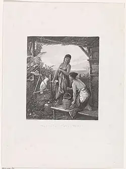 Twee jonge Indonesische vrouwen bij een papegaai