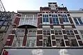Winkelpand met van oorsprong een bovenwoning in neo-renaissance stijl